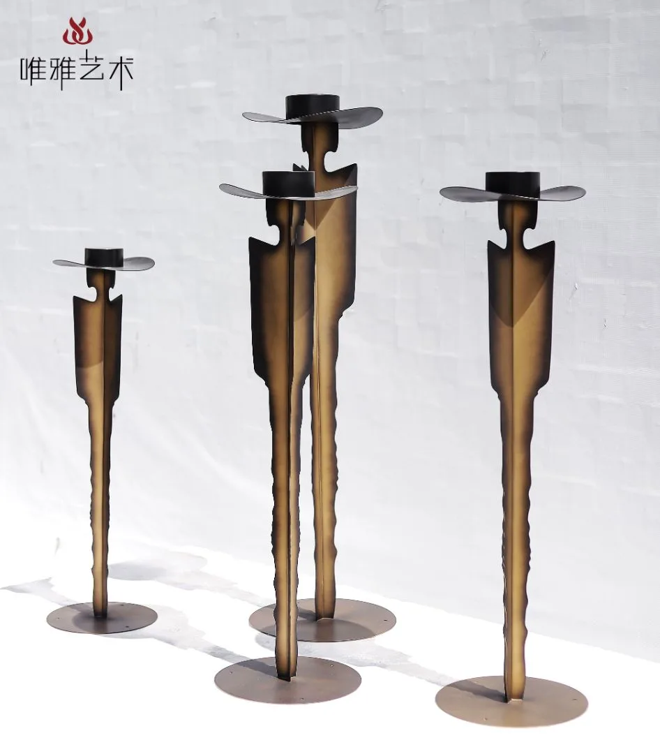 Existing Weiya catalogue photograph of three slender decorative metal forms displayed together